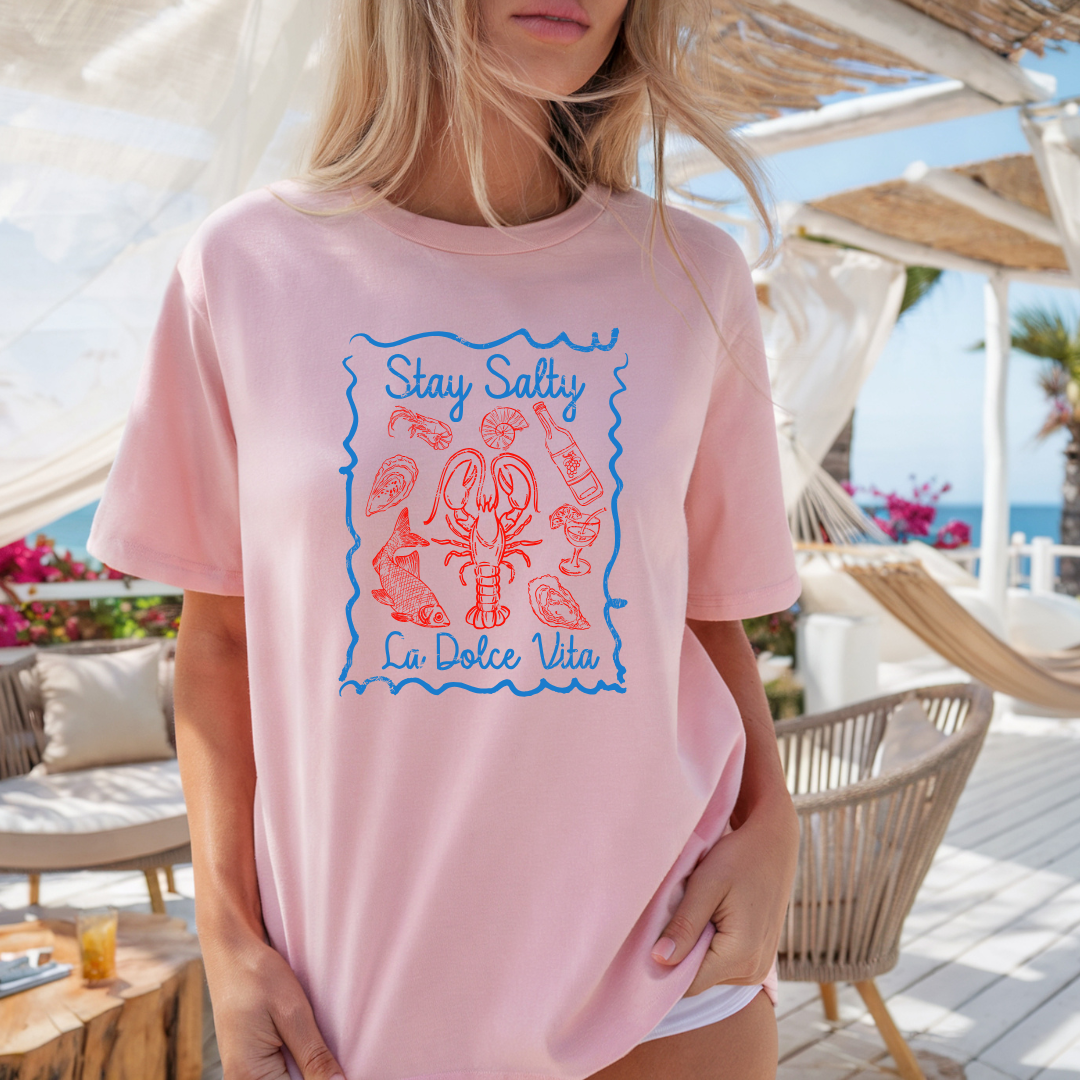Camiseta casual de corte holgado con cuello redondo, manga corta, 100% Algodón, con gráfico de La Dolce Vita. Perfecta para el estilo diario.